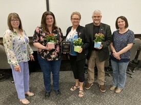 Group of people accepting an award