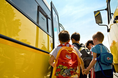 Students boarding yellow school bus