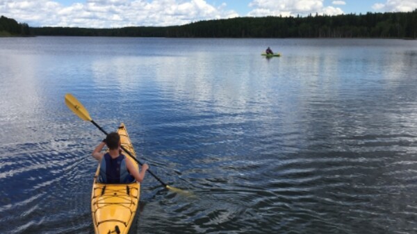 People in a canoe on a lake