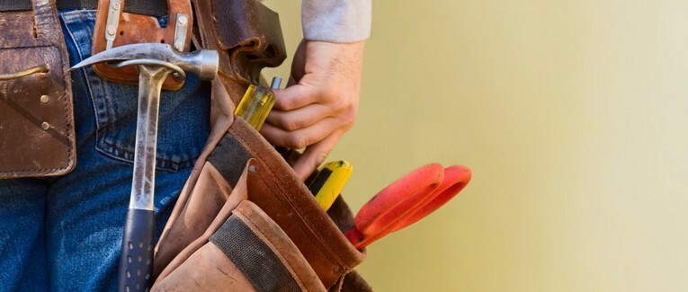 A person with a tool belt on